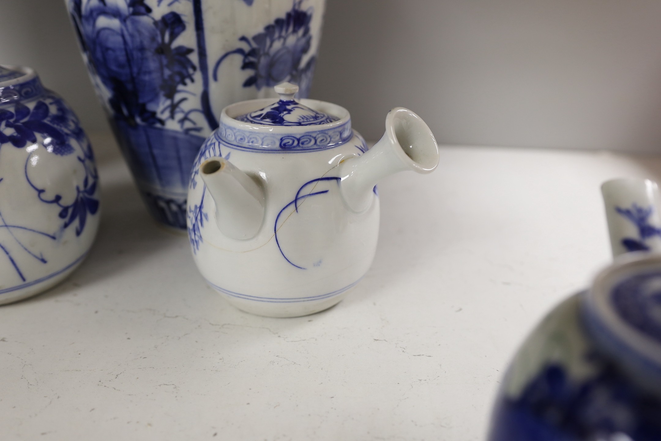 A pair of Japanese blue and white vases and various Japanese blue and white porcelain teapots and covers, tallest 30cm